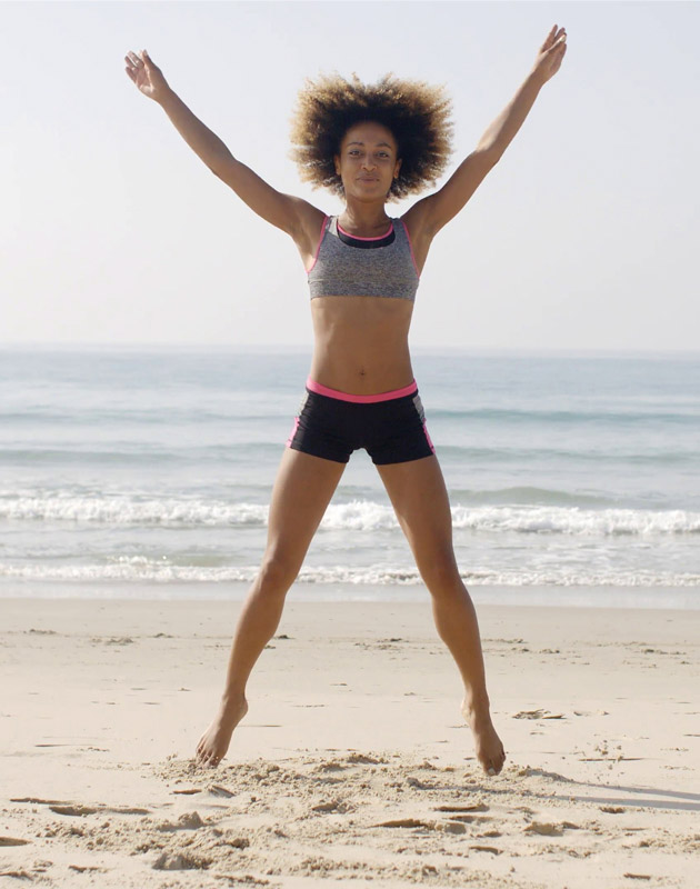 Woman Exercising on Beach